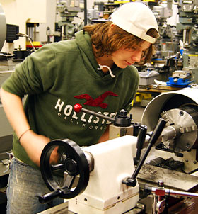 Student working on machine