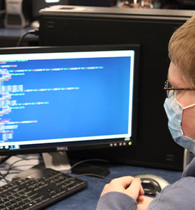 Student working on website code