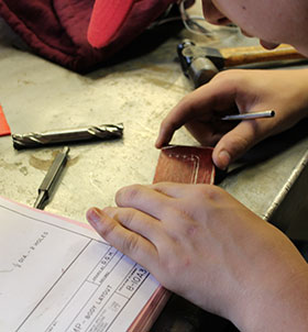 Student using measuring tool